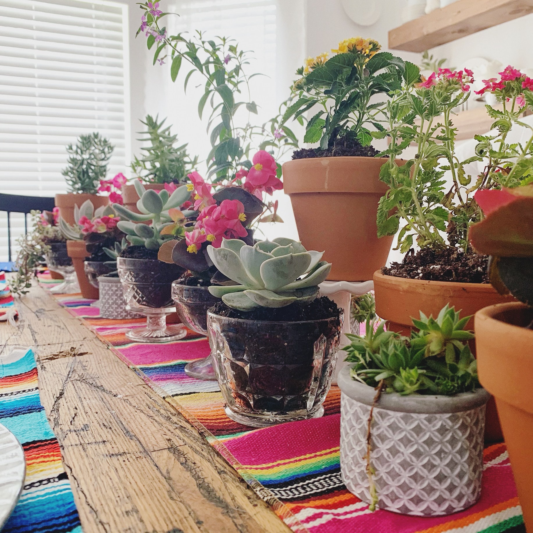 Colorful table runner and floral arrangement at a private party