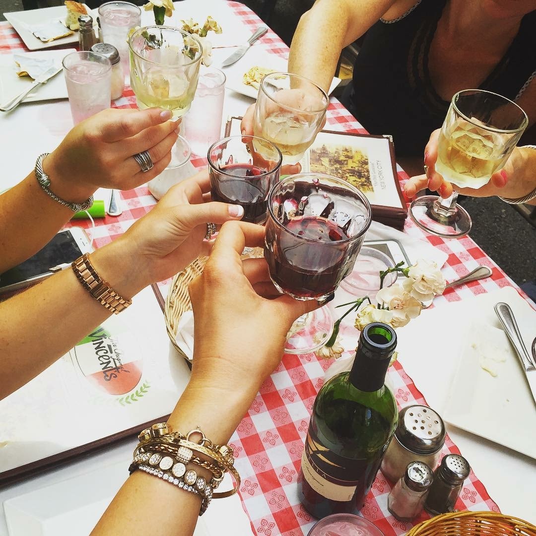Friends toasting drinks at a private party
